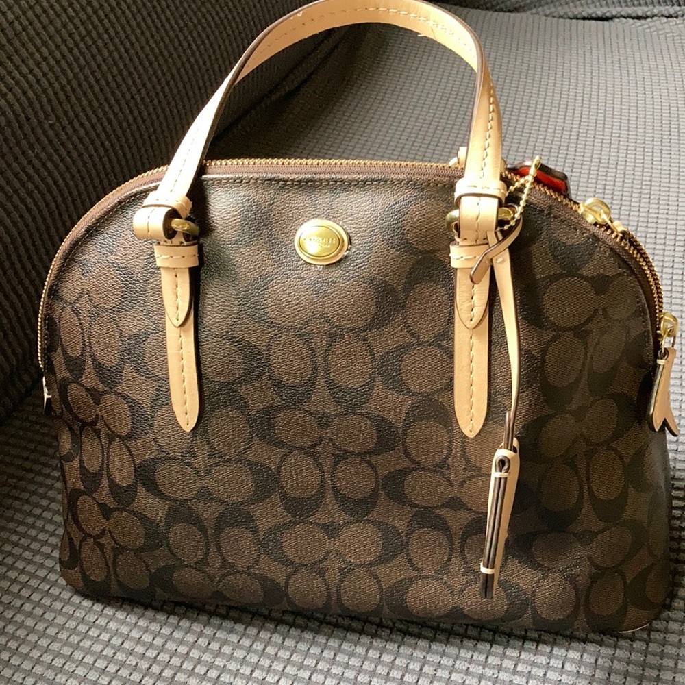 Slightly used Coach handbag brown coach embossed design.SOLD